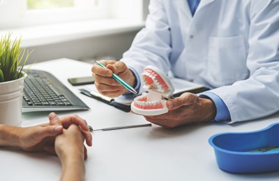 dentist explaining dental implants to patient