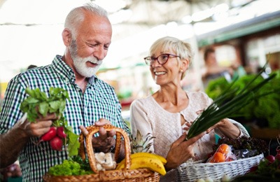 older couple shopping for healthy food