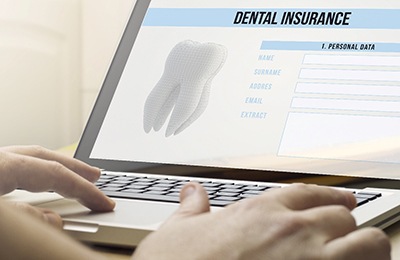 Patient looking at dental insurance information on computer