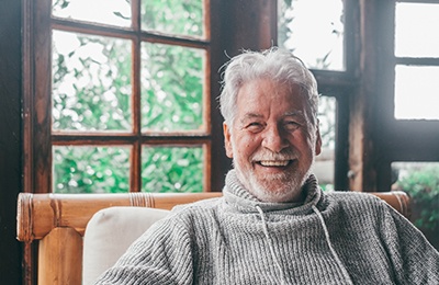 Closeup of senior man smiling at home