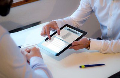 a patient learning about dental insurance for dental implants