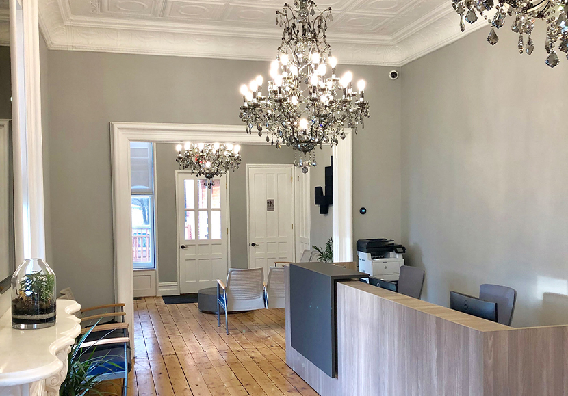 Ornate chandelier in reception area of Schoharie Dental