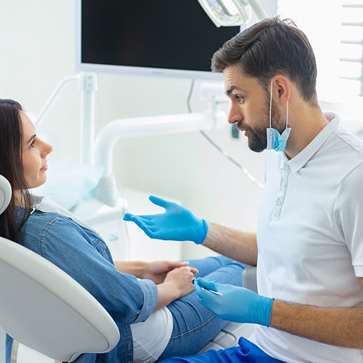 Patient talking to dentist about root canal