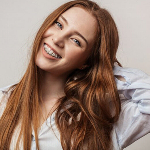 teen smiles with braces